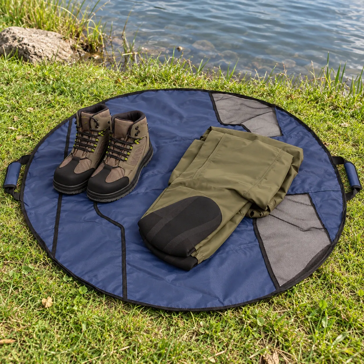 Finch Wader Bag - Navy — open changing mat; boots and waders are separate props